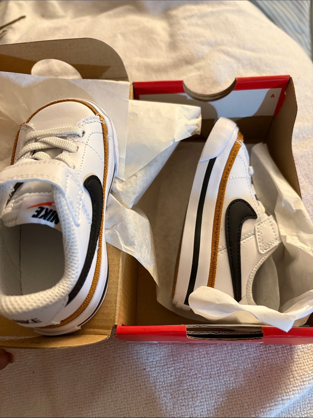 Nike Kids White Sneakers with Black Swoosh and Brown Trim